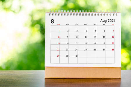 August 2021 Calendar desk for organizer to plan and reminder on wooden table on nature background.の写真素材
