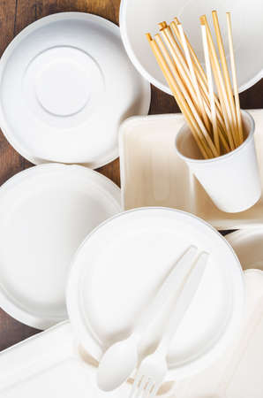 Eco friendly biodegradable paper disposable for packaging food with wheat straw for drinking water on wooden background.の写真素材