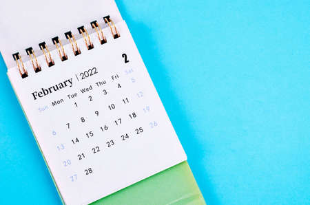 Close up February calendar 2022 on blue background.の写真素材