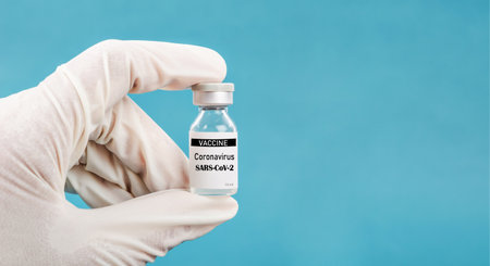 Hand holding coronavirus vaccine. sars-cov-2 COVID-19.の写真素材