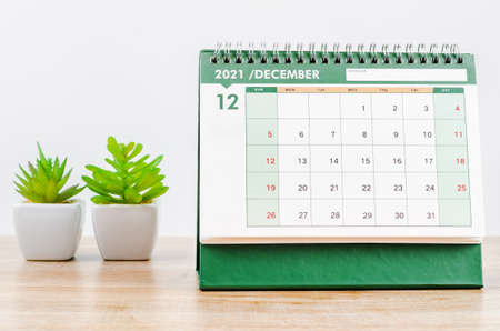 December 2021 Desk calendar on wooden table.の写真素材