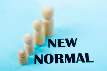Person wooden doll standing with New normal. Life after pandemic concept.