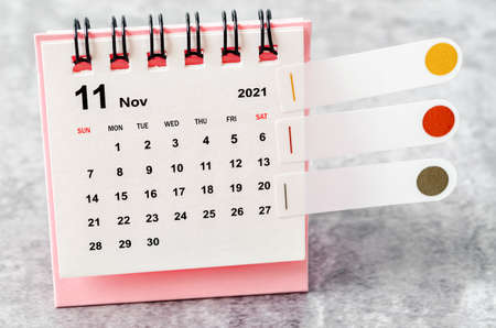November 2021 desk calendar on the table.の写真素材