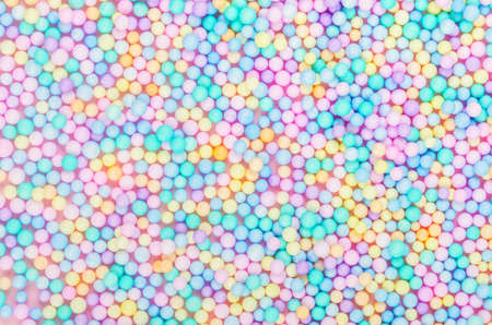 Foam beads of various colors brightly colored abstract background.の写真素材