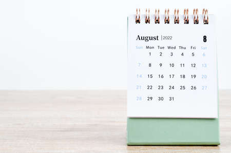 The August 2022 desk calendar on wooden table.の写真素材