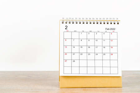 The February 2022 desk calendar on wooden background.の写真素材