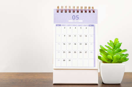 May desk calendar 2022 on the wooden table.の写真素材