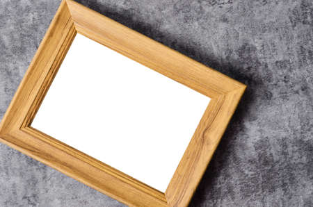Empty wooden frame on dark backgroundの写真素材