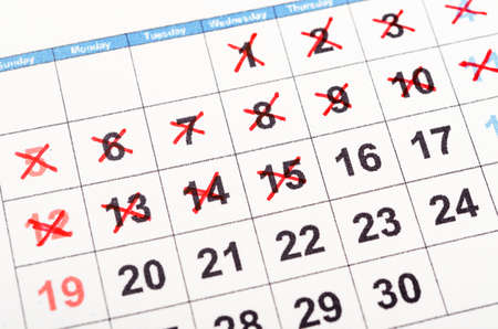 The Red cross mark on the calendarの写真素材
