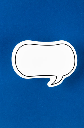 Speech bubble with copy space communication talking speaking concepts on blue color background.