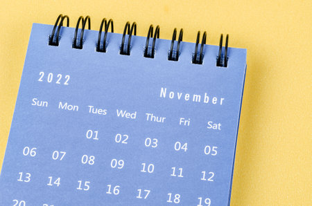 November 2022 Monthly desk calendar for 2022 year on yellow background.