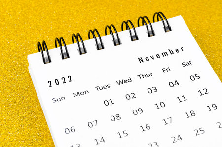 November 2022 Monthly desk calendar for 2022 year on golden color background.の写真素材