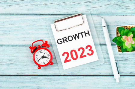 2023 Growth : Goal and Target Setting List for 2023 year with alarm clock. Change and determination...