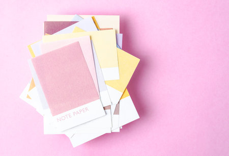 Colorful blank sticky note papers on pink colour background for your text or message.の写真素材