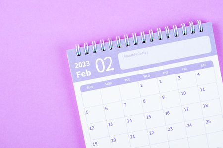 February 2023 calendar desk for the organizer to plan and reminder isolated on purple background.の写真素材