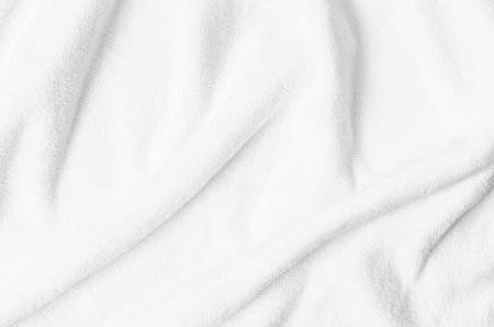 Textured white natural cotton towel background photo with selective focus.の写真素材