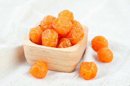 Delicious dried  small yellow plums (mirabelles). Shallow depth of field.の写真素材