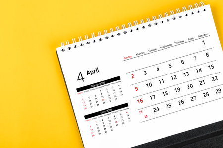 April 2023 Monthly desk calendar for 2023 year on yellow color background.の写真素材