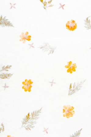 Handmade recycled flower and leaf paper background.の写真素材