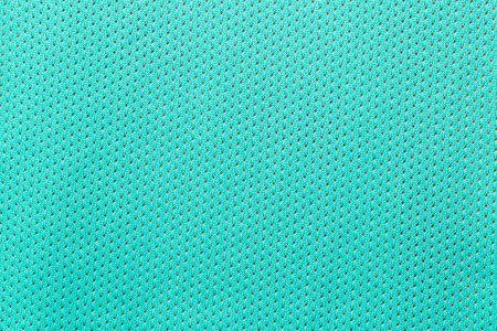 Texture of knitted turquoise yarn fabric background.の写真素材