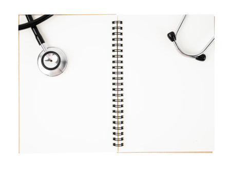 Blank medical notebook with stethoscope isolated on white background. Save clipping path.の写真素材