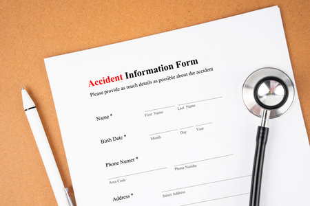 Blank Accident information form and stethoscope medical with pen.の写真素材