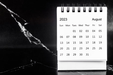 August 2023 Monthly desk calendar for 2023 year on black marble background.の写真素材