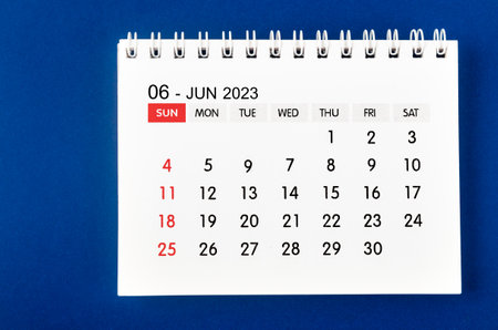June 2023 Monthly desk calendar for 2023 year on blue background.の写真素材