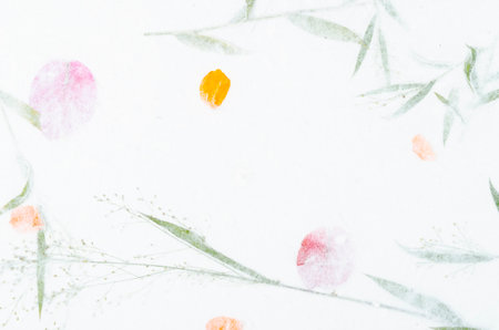 Handmade recycled flower and leaf paper background.