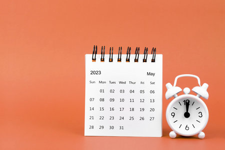 May 2023 Monthly desk calendar for 2023 year and alarm clockの写真素材