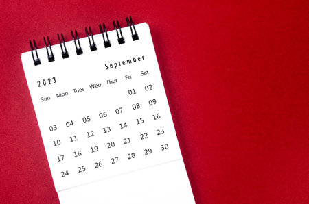 September 2023 Monthly desk calendar for 2023 year on red background.の写真素材