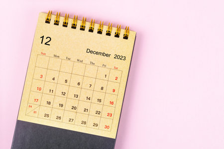 December 2023 Monthly desk calendar for 2023 year made from craft paper on beautiful background.