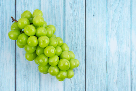 Freshness Japanese Shine Muscat Grape on wooden blue background.の写真素材
