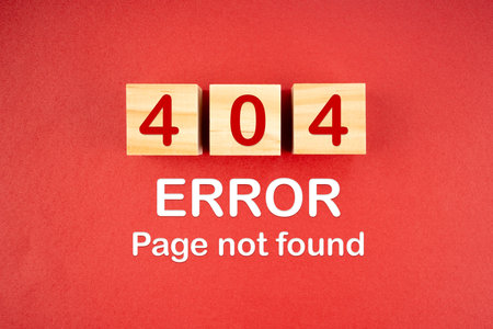 Wooden cubes with 404 error page not found on red background.の写真素材
