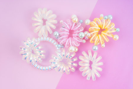 Colorful plastic hair elastics set on beautiful background.の写真素材