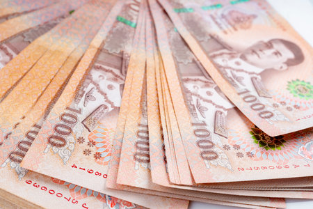 Heap of Thai 1,000 baht banknotes issued by the Bank Of Thailand.