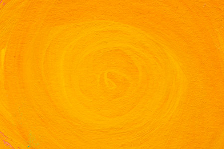 Yellow watercolor painting on paper background textureの写真素材