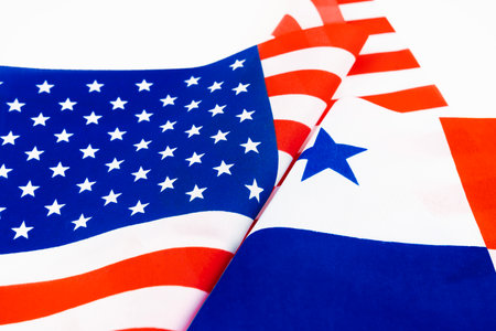 Relations between america and panama flag on white color background.の写真素材