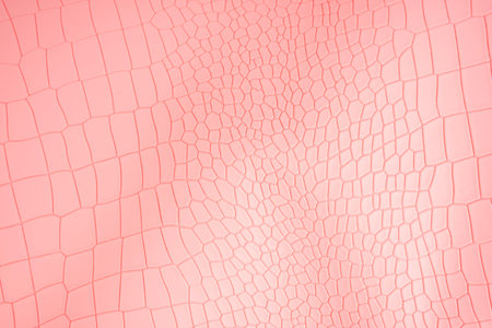 Pink color crocodile skin artificial leather with waves and folds on PVC base.の写真素材