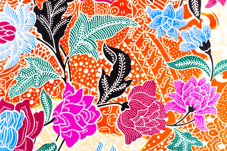 Beautiful handmade batik fabric texture with abstract floral ornament.