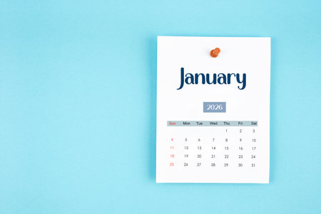 January 2026 calendar page with push pin on blue color background.の写真素材