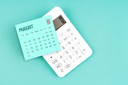 August 2025 calendar card with calculator on blue color background.