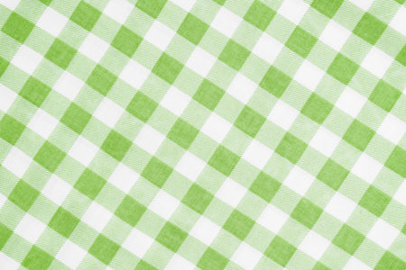 Wrinkled classic green color plaid fabric or tablecloth background.の写真素材