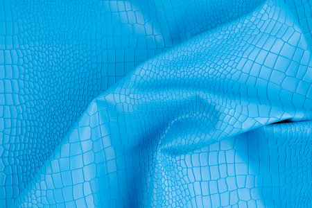 Blue color artificial crocodile leather texture as background.の写真素材