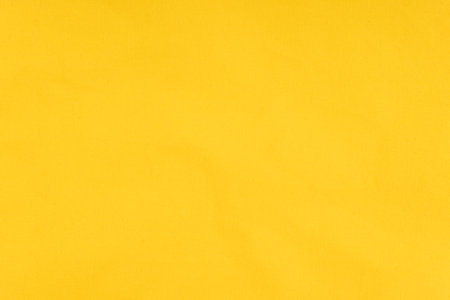 Yellow color linen fabric cloth texture background, pattern of natural textile.の写真素材
