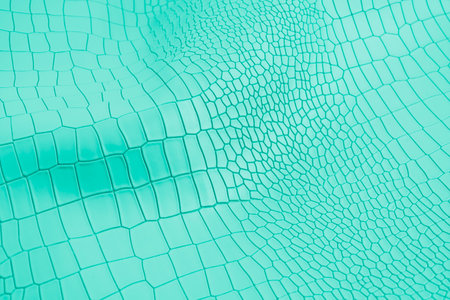 Turquoise color artificial crocodile leather texture as background.の写真素材