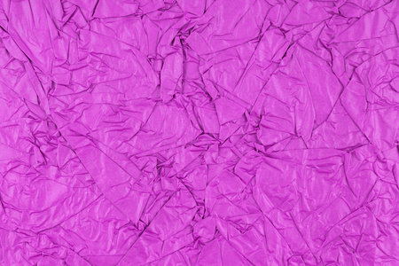 Purple color crumpled paper texture as background.の写真素材
