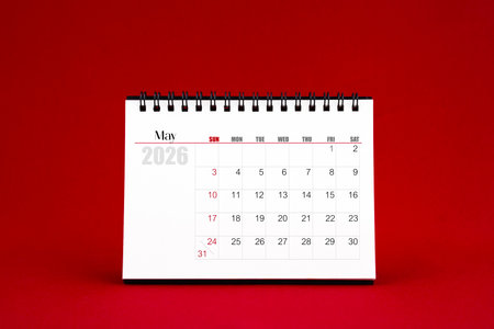 May 2026 Blank desk calendar on red background.の写真素材