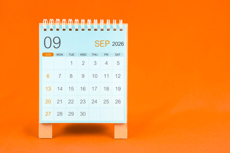 September 2026 desk calendar stand on orange textile background.の写真素材
