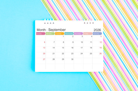 September 2026 desk calendar on blue and rainbow background.の写真素材